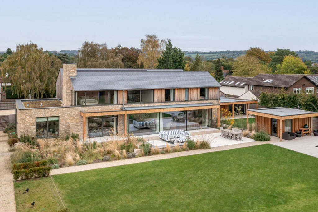Aerial view of Park House in the Cotswolds from the rear