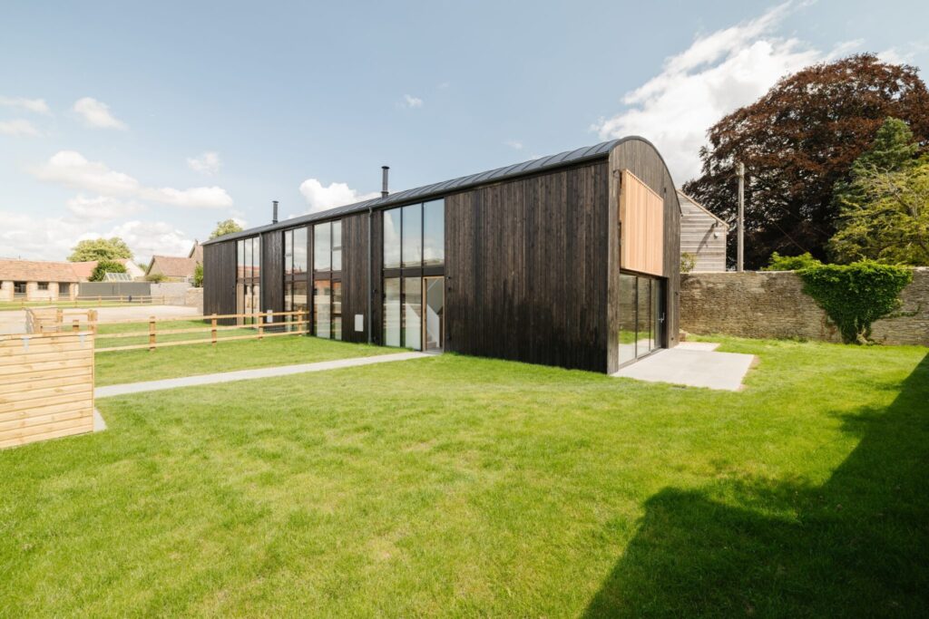Exterior view of a barn conversion at The Farmyard in Grittleton, Wiltshire